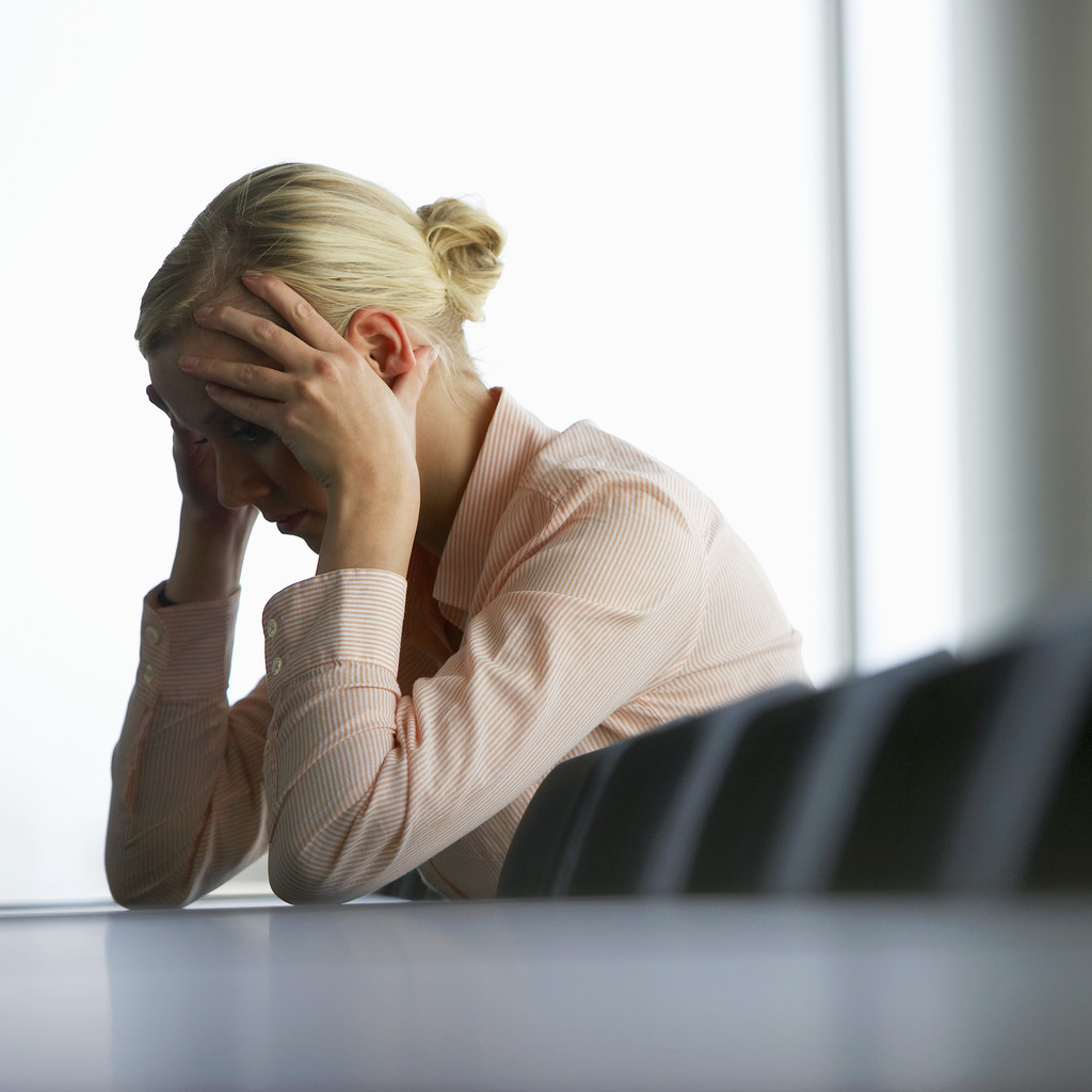 Stressed Businesswoman --- Image by © Royalty-Free/Corbis